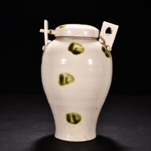 Tang Dynasty Xing kiln white porcelain green glaze dotted lid jar