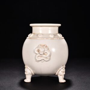Tang Dynasty Xing kiln white porcelain laminated dragon pattern three-legged jar