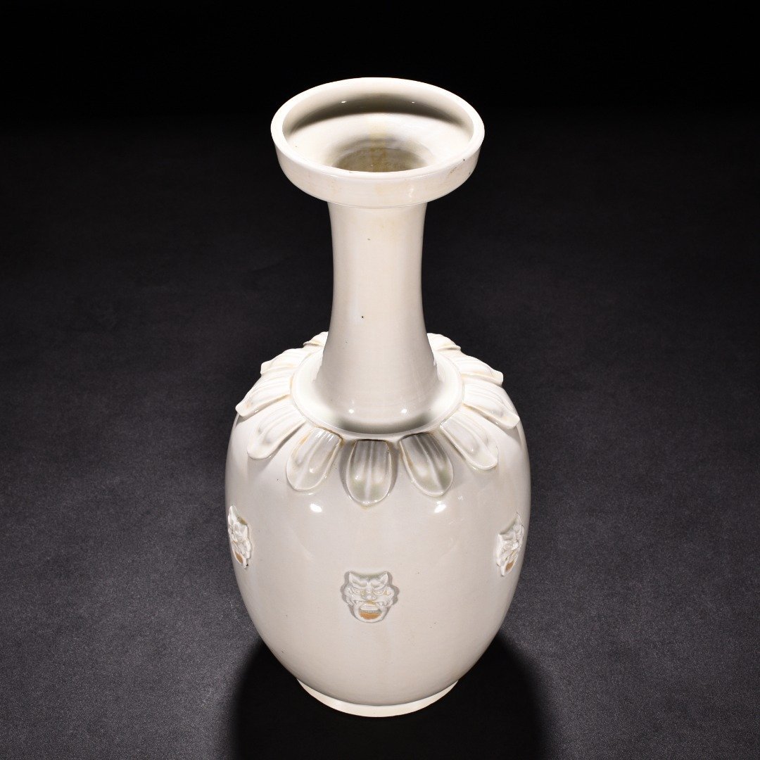 Tang Dynasty Xing kiln white porcelain laminated lotus petal animal ear disc-mouth bottle