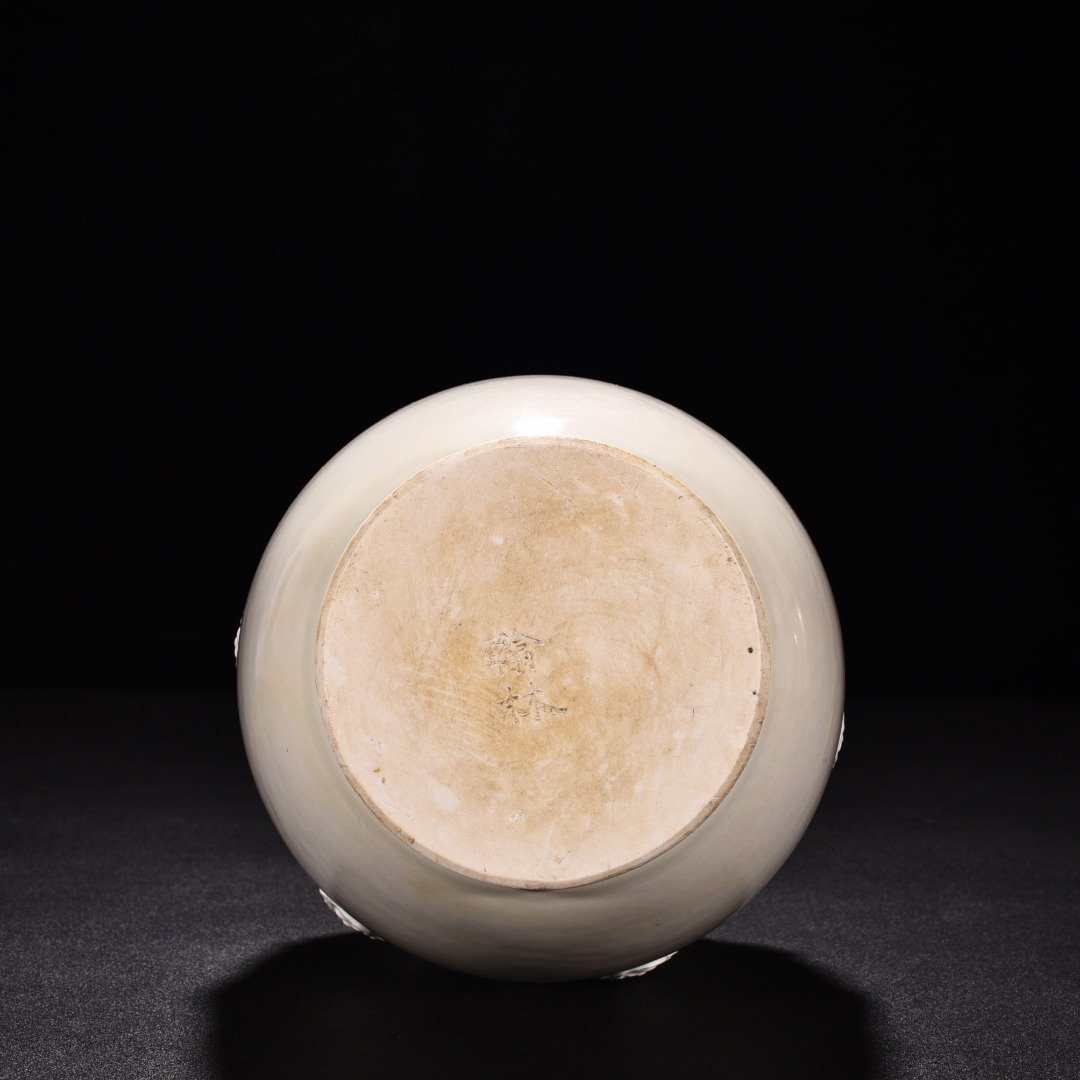 Tang Dynasty Xing kiln white porcelain laminated lotus petal animal ear disc-mouth bottle