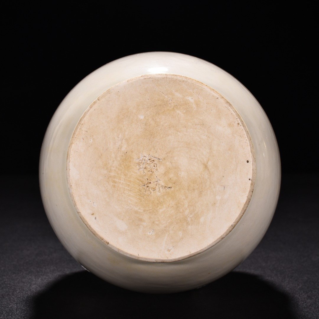 Tang Dynasty Xing kiln white porcelain laminated lotus petal animal ear disc-mouth bottle