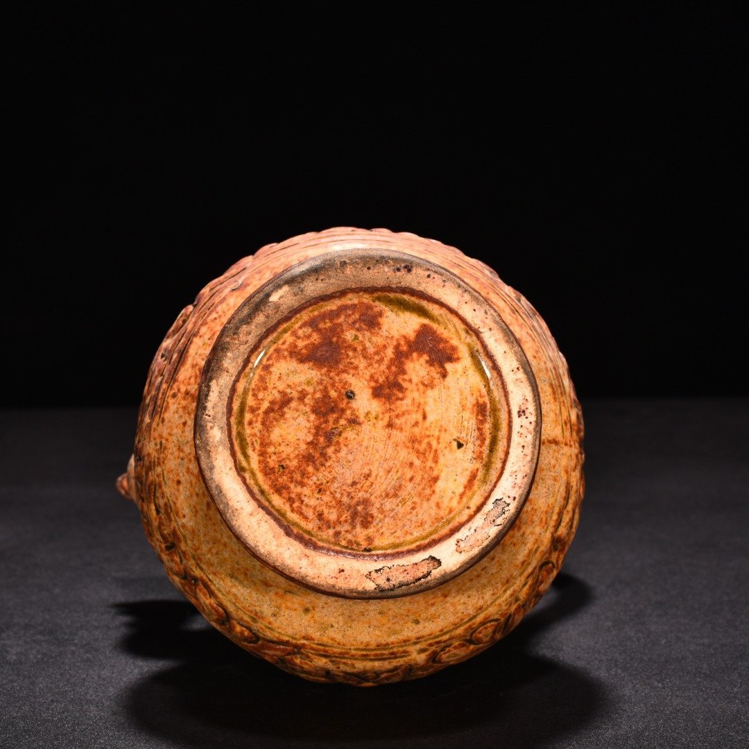 Tang Dynasty yellow glaze phoenix head pot