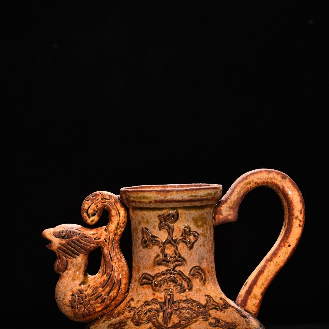 Tang Dynasty yellow glaze phoenix head pot