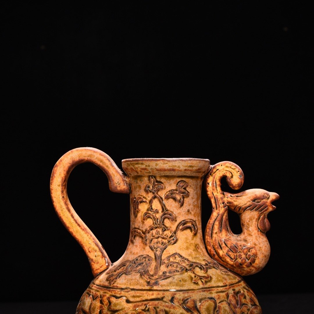 Tang Dynasty yellow glaze phoenix head pot