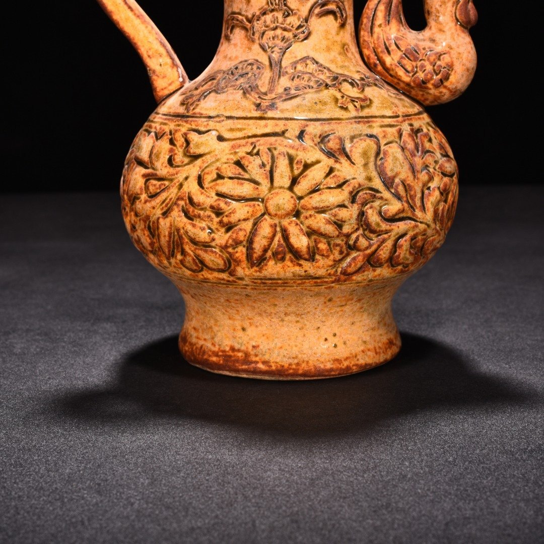 Tang Dynasty yellow glaze phoenix head pot
