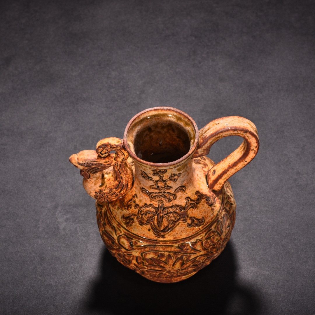 Tang Dynasty yellow glaze phoenix head pot