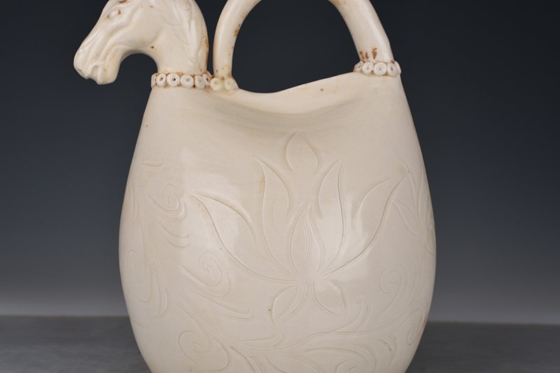 Song Dynasty Ding kiln carved imitation leather bag