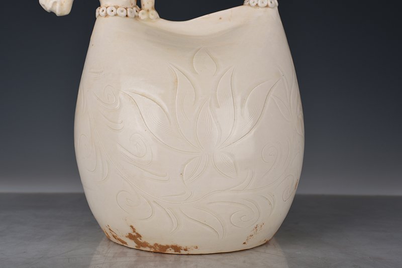 Song Dynasty Ding kiln carved imitation leather bag