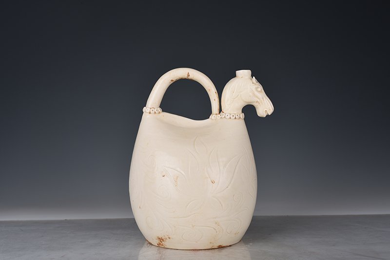 Song Dynasty Ding kiln carved imitation leather bag