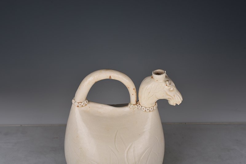 Song Dynasty Ding kiln carved imitation leather bag