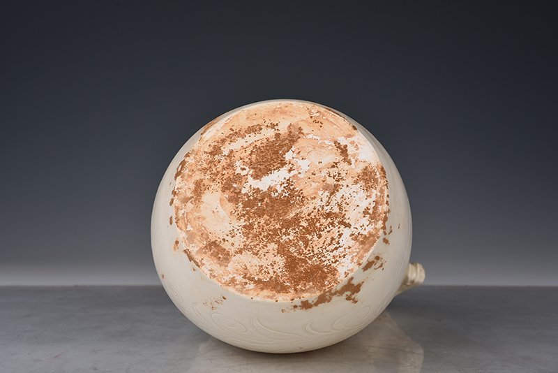Song Dynasty Ding kiln carved imitation leather bag