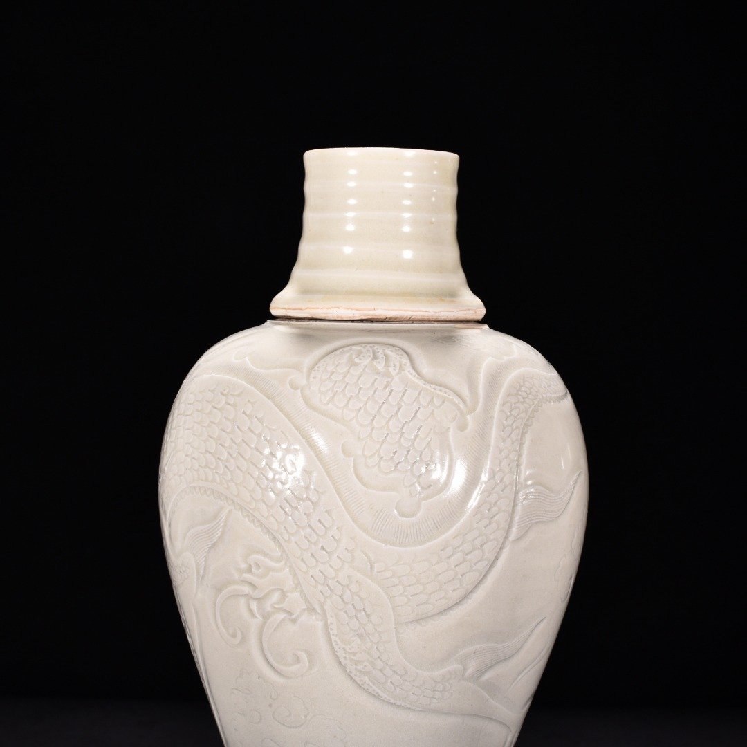 Song Dynasty Ding kiln carved plum vase with dragon pattern and lid