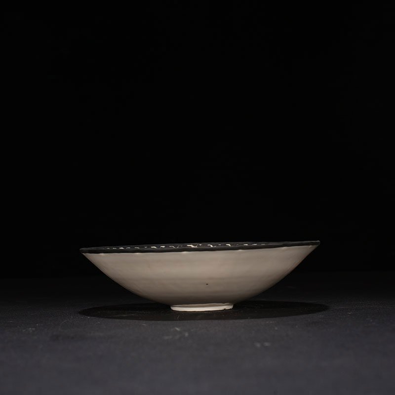 Song Dynasty Ding kiln printed flower pattern bowl