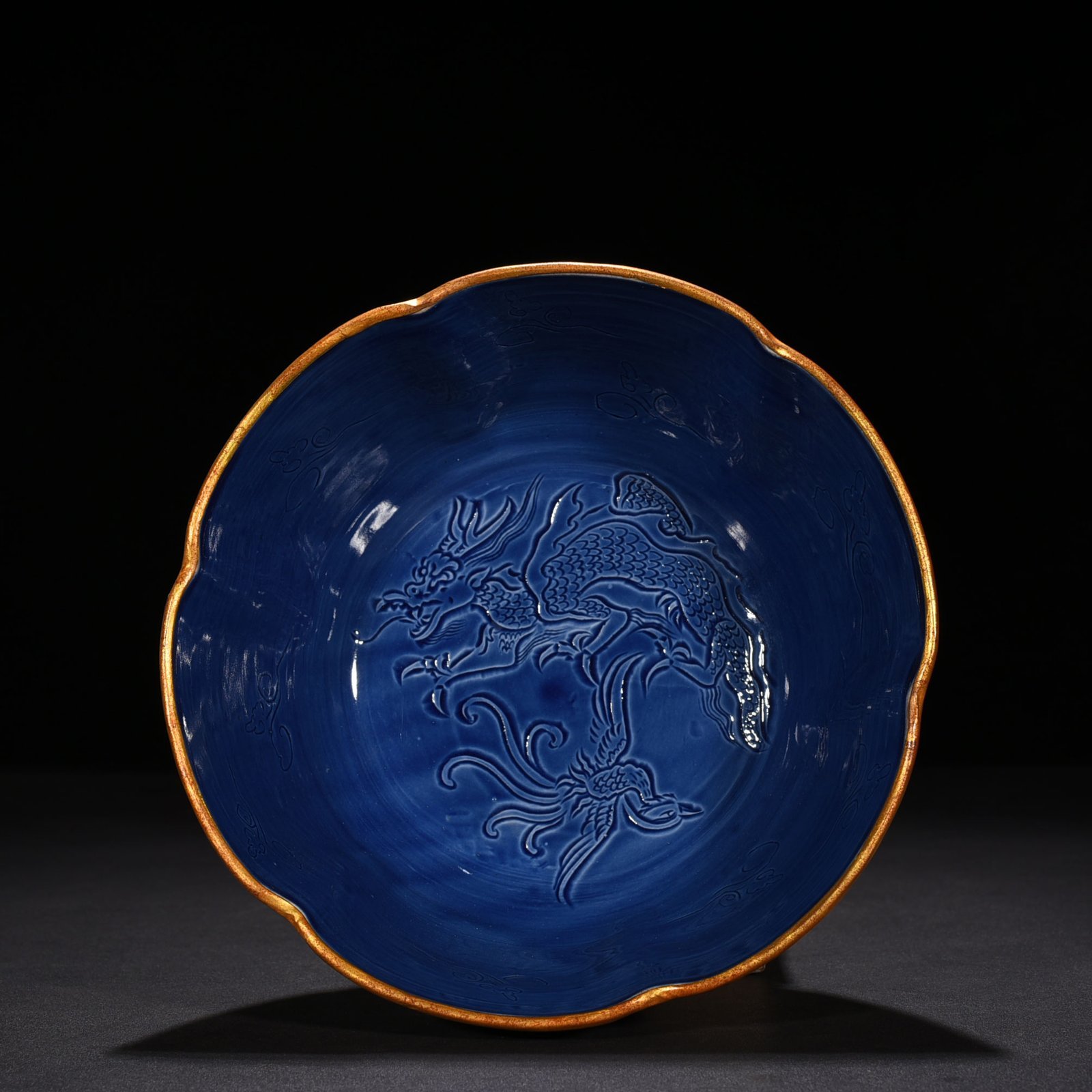 Song Dynasty Ding kiln official style blue glaze engraved dragon and phoenix bowl