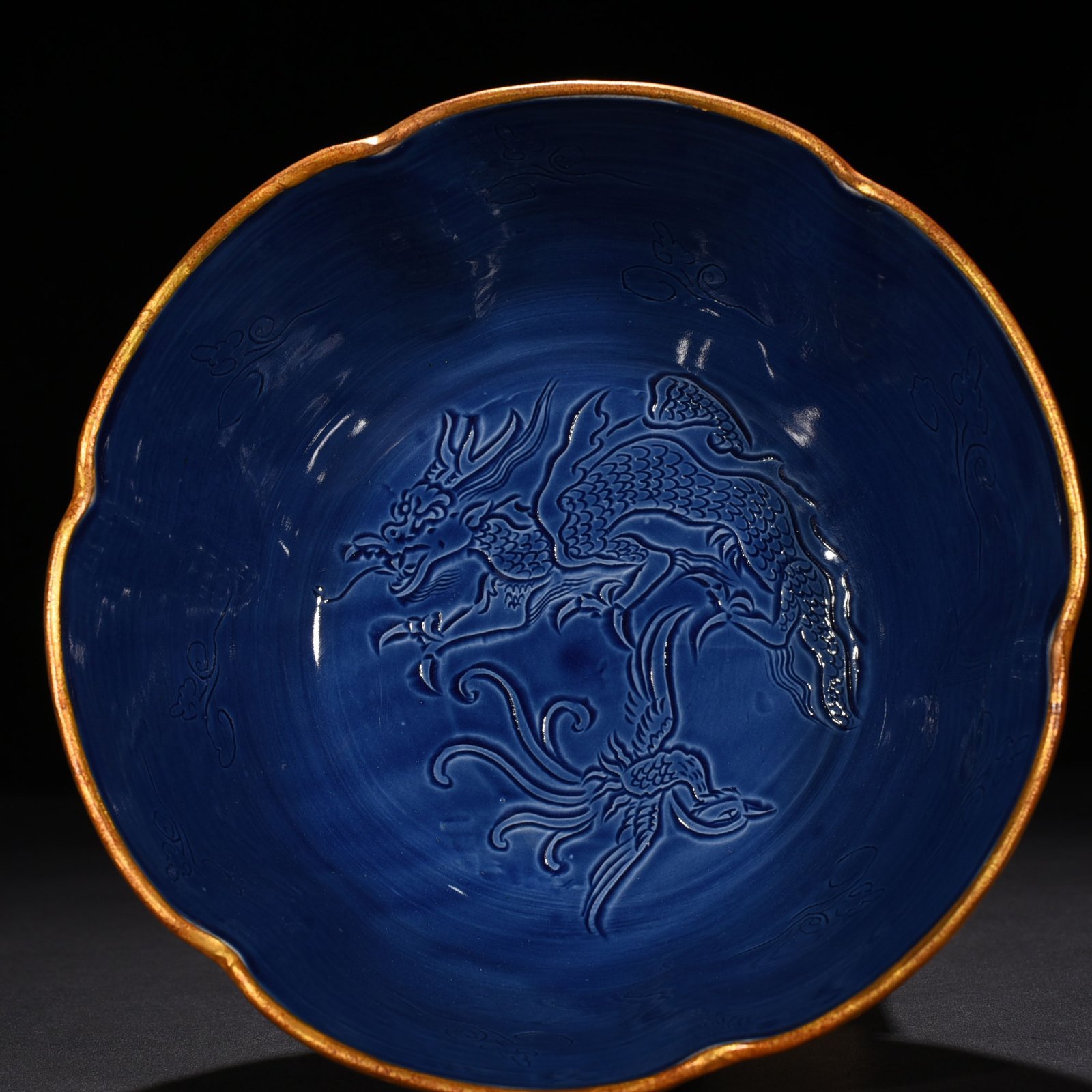 Song Dynasty Ding kiln official style blue glaze engraved dragon and phoenix bowl