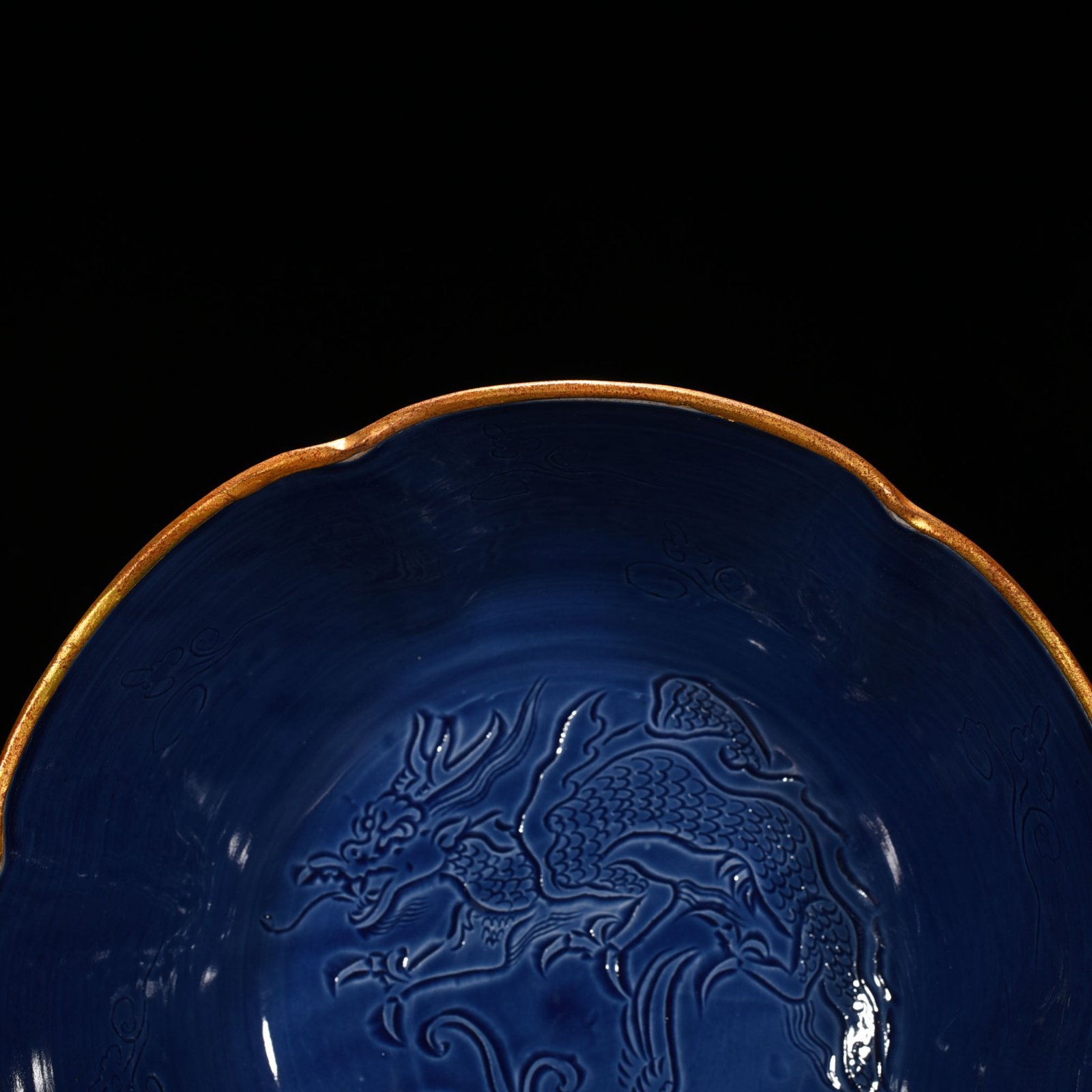 Song Dynasty Ding kiln official style blue glaze engraved dragon and phoenix bowl