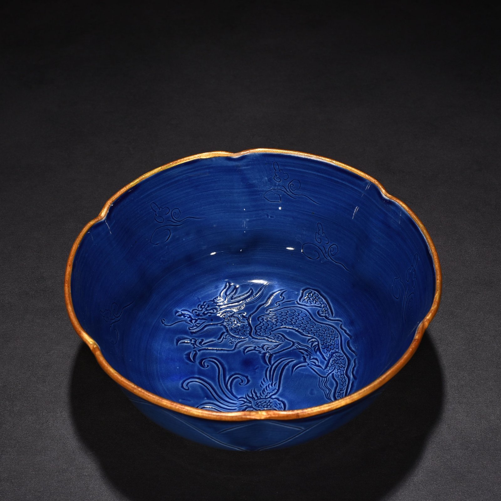 Song Dynasty Ding kiln official style blue glaze engraved dragon and phoenix bowl