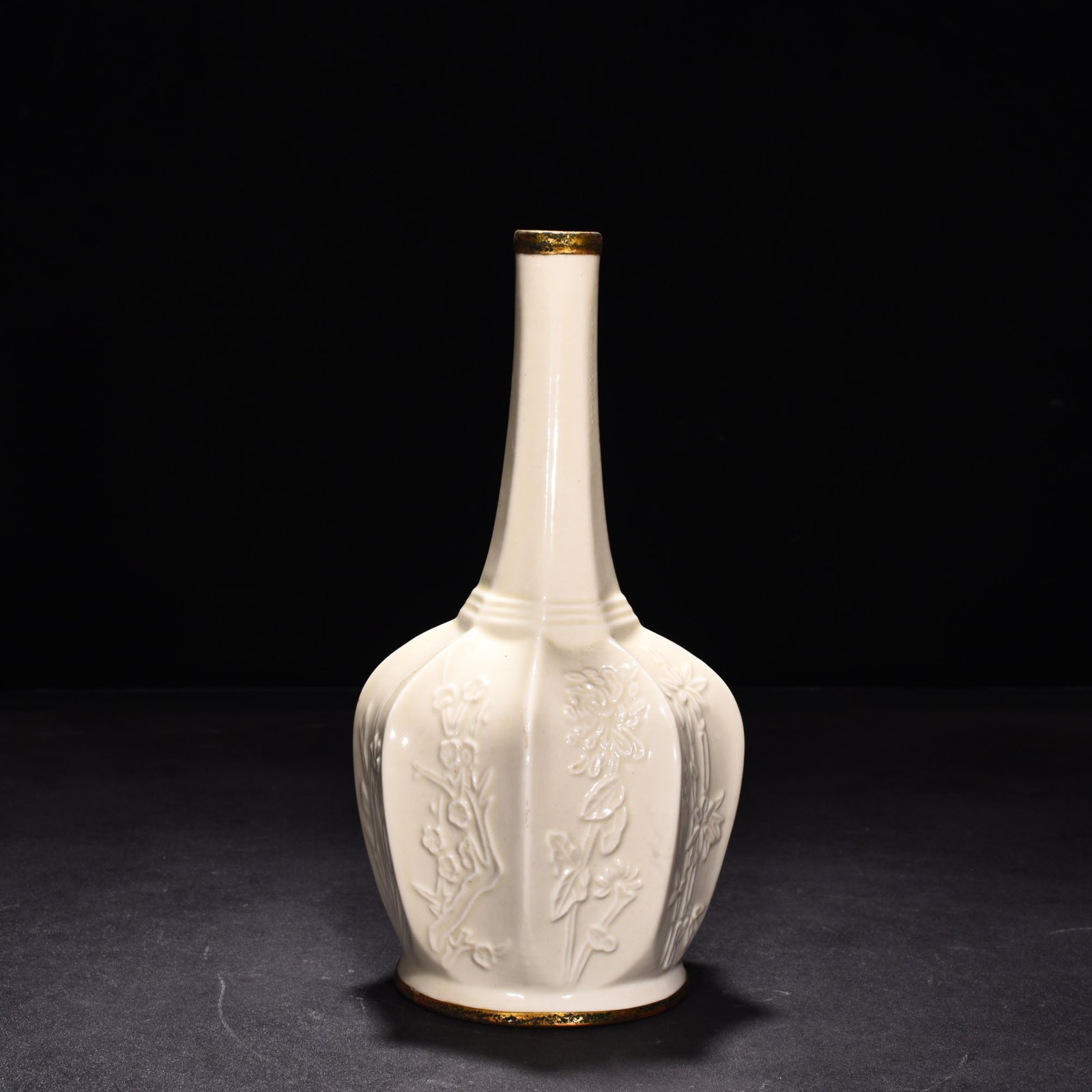 Song Dynasty Ding kiln plum orchid bamboo and chrysanthemum eight-sided pure vase