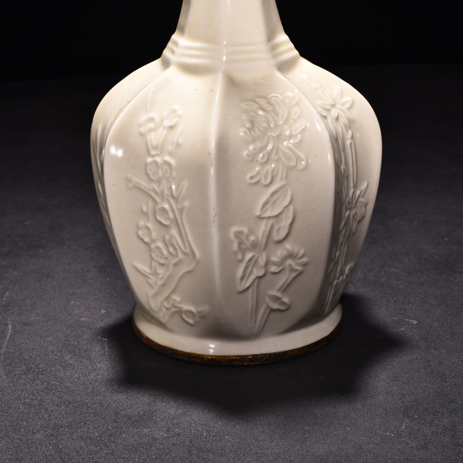 Song Dynasty Ding kiln plum orchid bamboo and chrysanthemum eight-sided pure vase