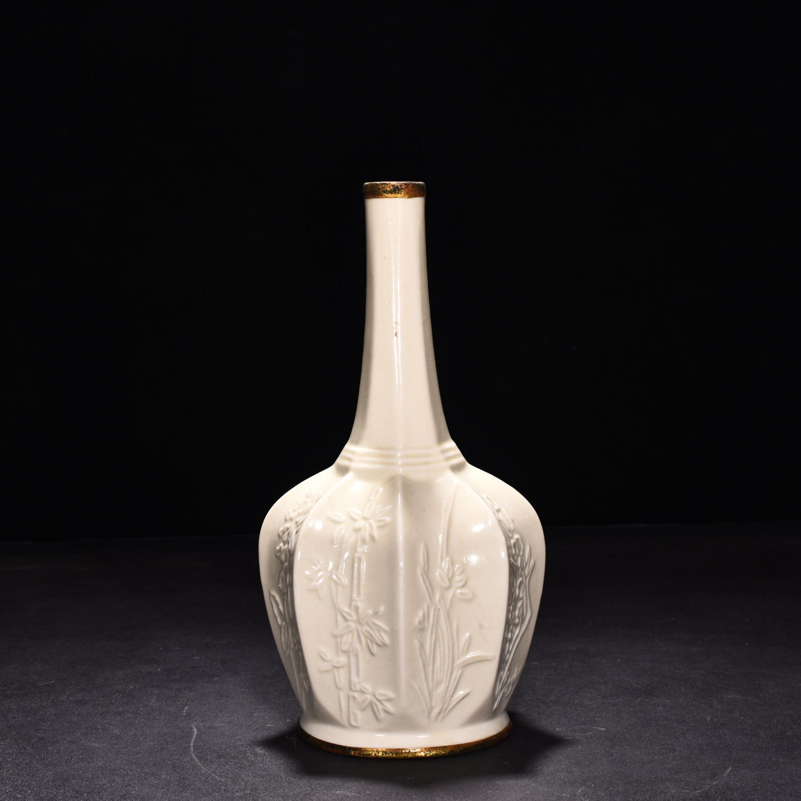 Song Dynasty Ding kiln plum orchid bamboo and chrysanthemum eight-sided pure vase