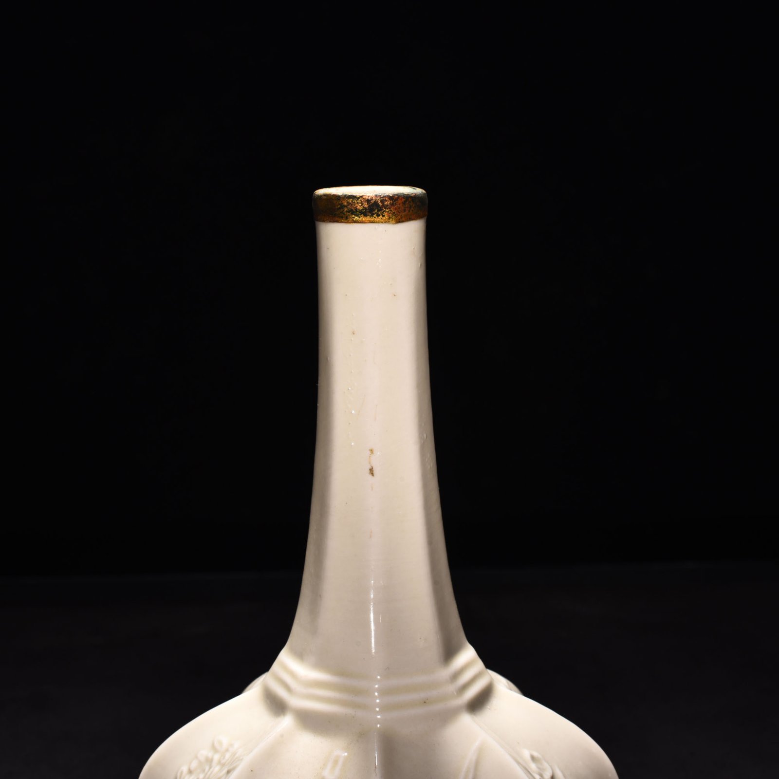 Song Dynasty Ding kiln plum orchid bamboo and chrysanthemum eight-sided pure vase