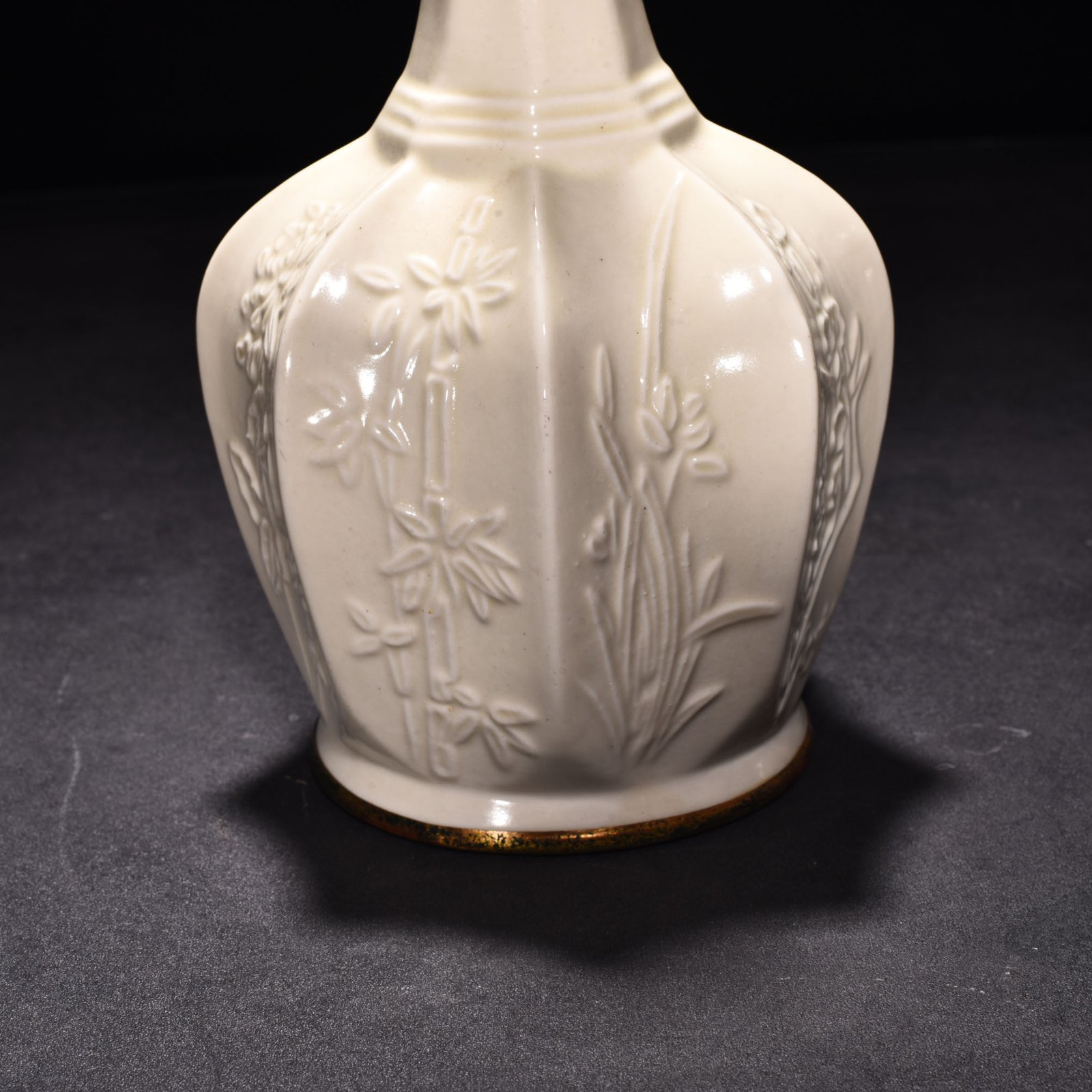 Song Dynasty Ding kiln plum orchid bamboo and chrysanthemum eight-sided pure vase