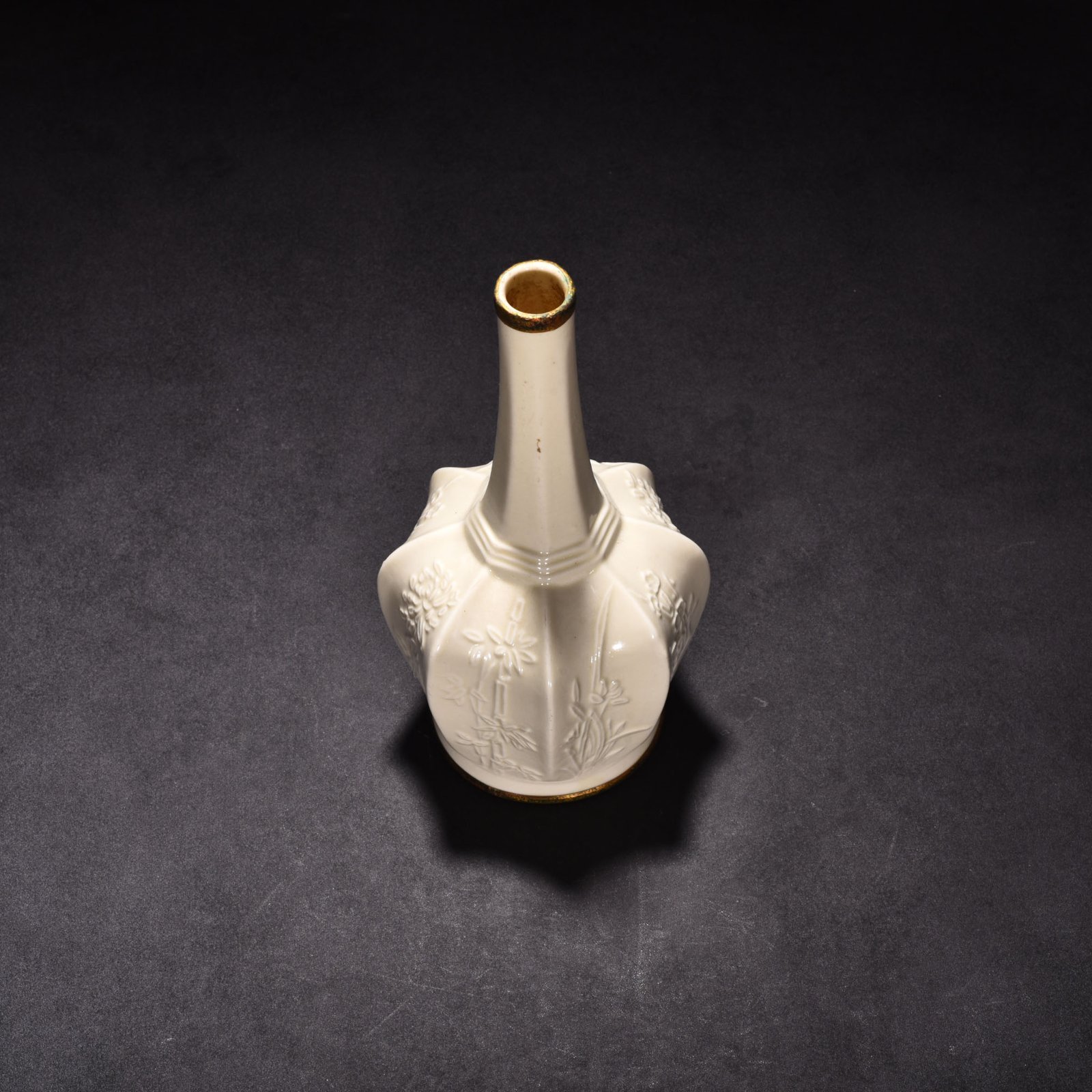 Song Dynasty Ding kiln plum orchid bamboo and chrysanthemum eight-sided pure vase