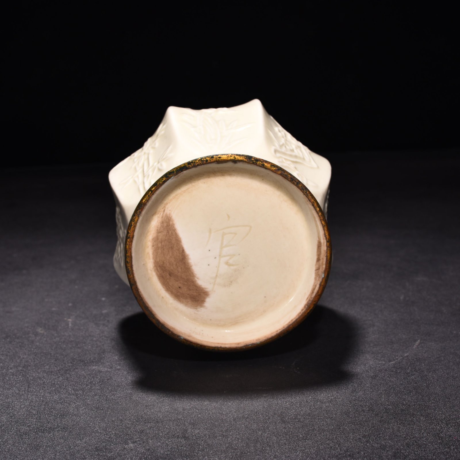 Song Dynasty Ding kiln plum orchid bamboo and chrysanthemum eight-sided pure vase
