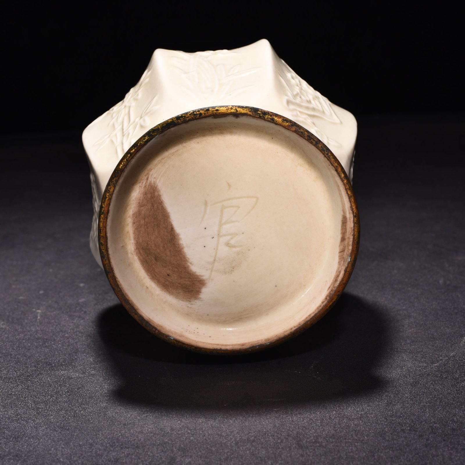 Song Dynasty Ding kiln plum orchid bamboo and chrysanthemum eight-sided pure vase