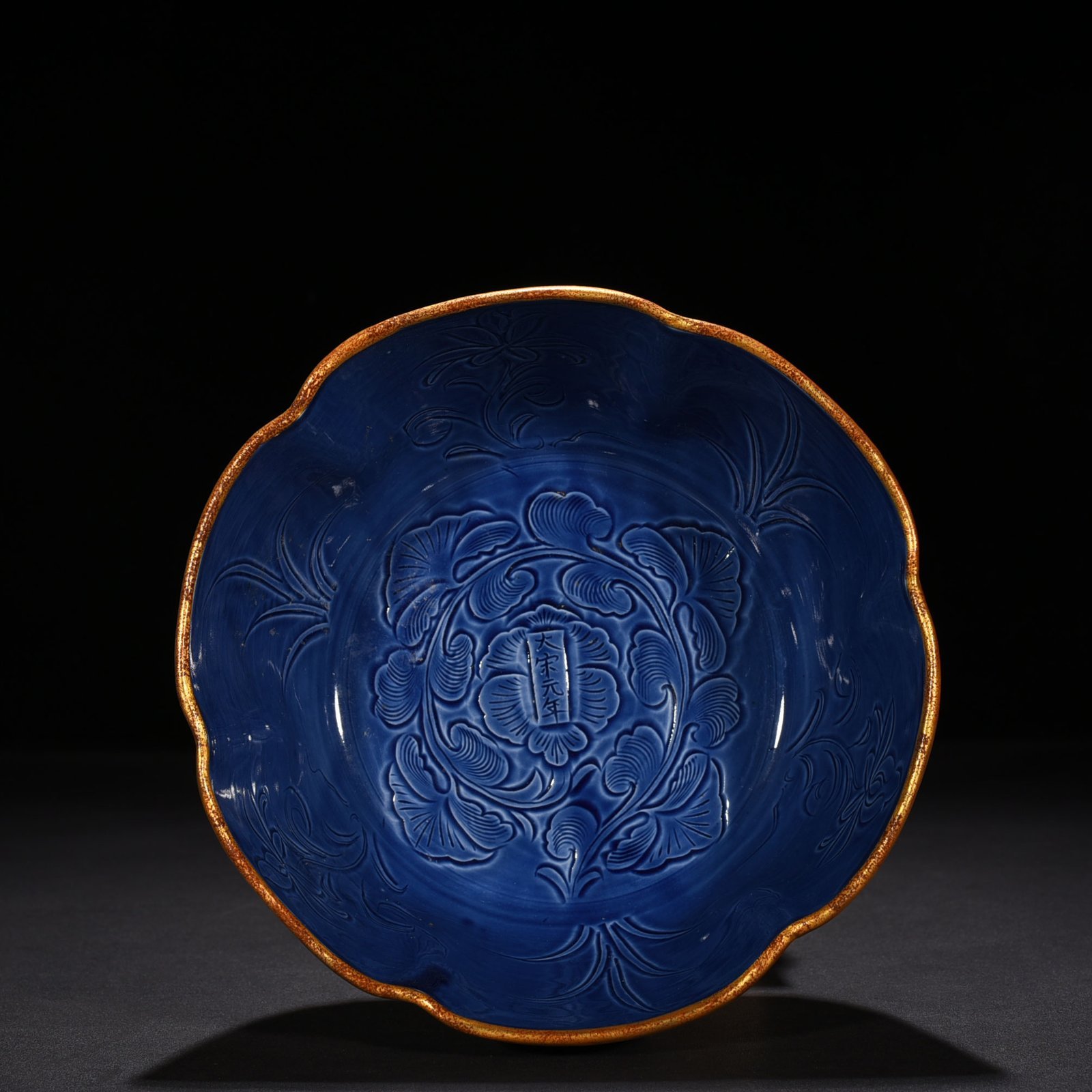 Song Dynasty Ding kiln blue glaze carved peony pattern sunflower bowl