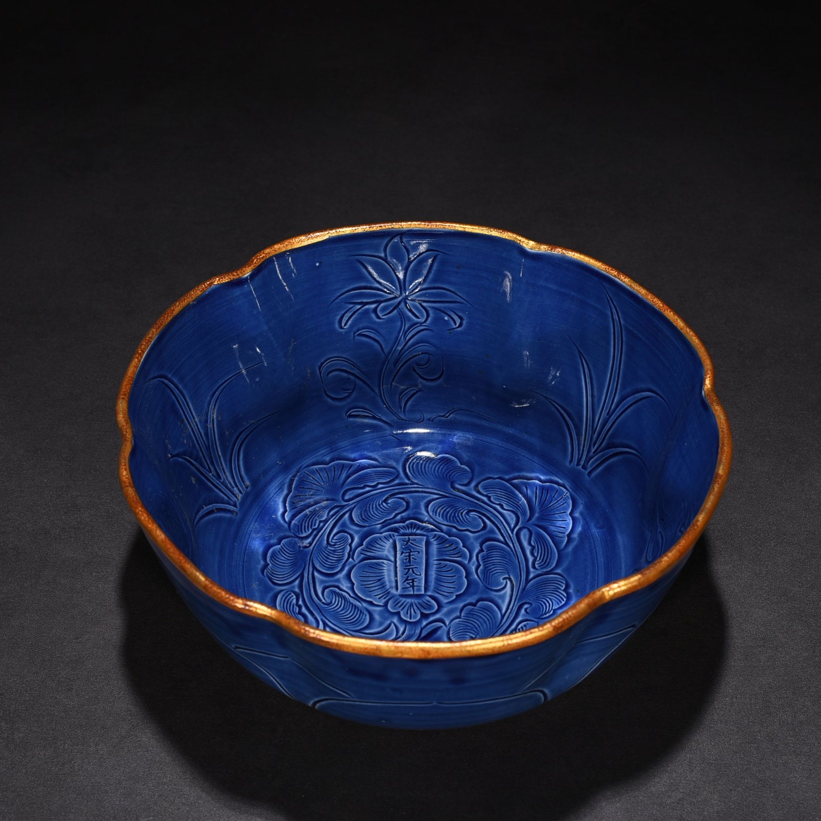 Song Dynasty Ding kiln blue glaze carved peony pattern sunflower bowl