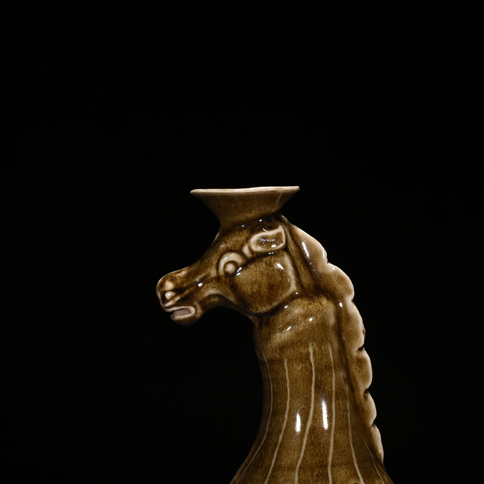 Song Dynasty Ding kiln brown color carved horse head pot