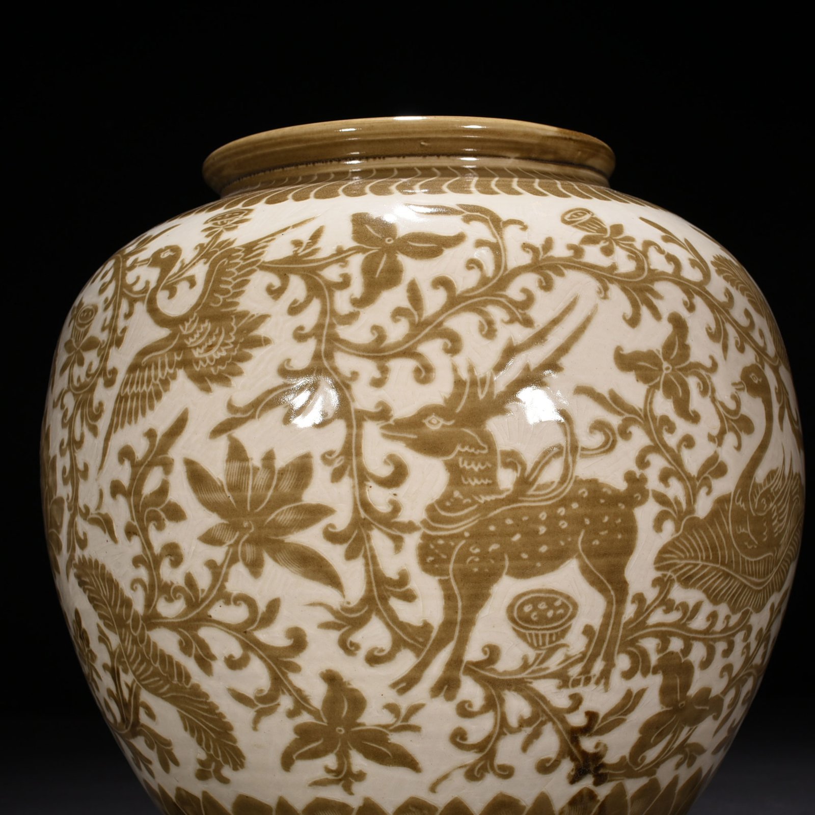 Song Dynasty Ding kiln brown color engraved jar with deer and crane pattern