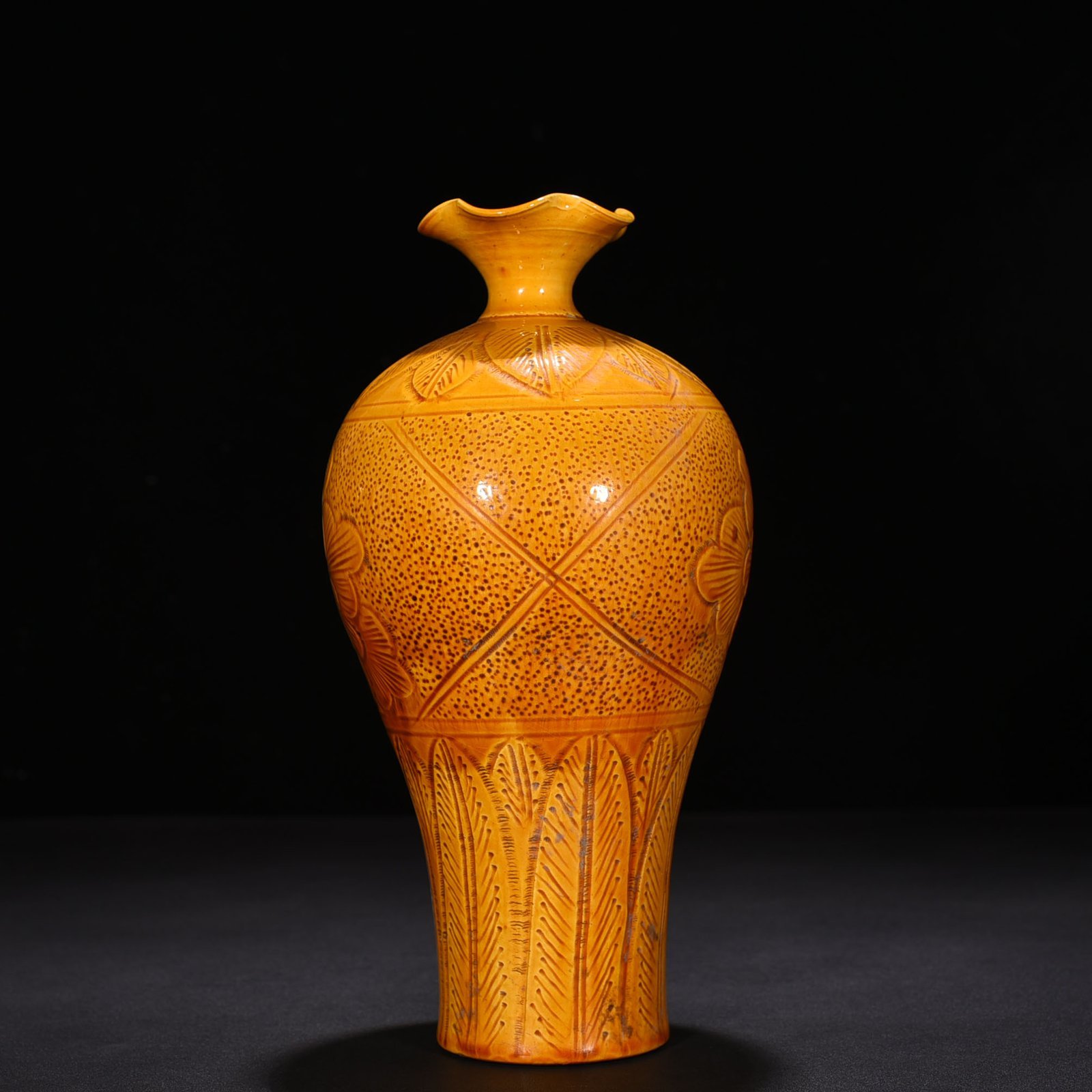 Song Dynasty Ding kiln yellow glaze engraved flower pattern plum vase