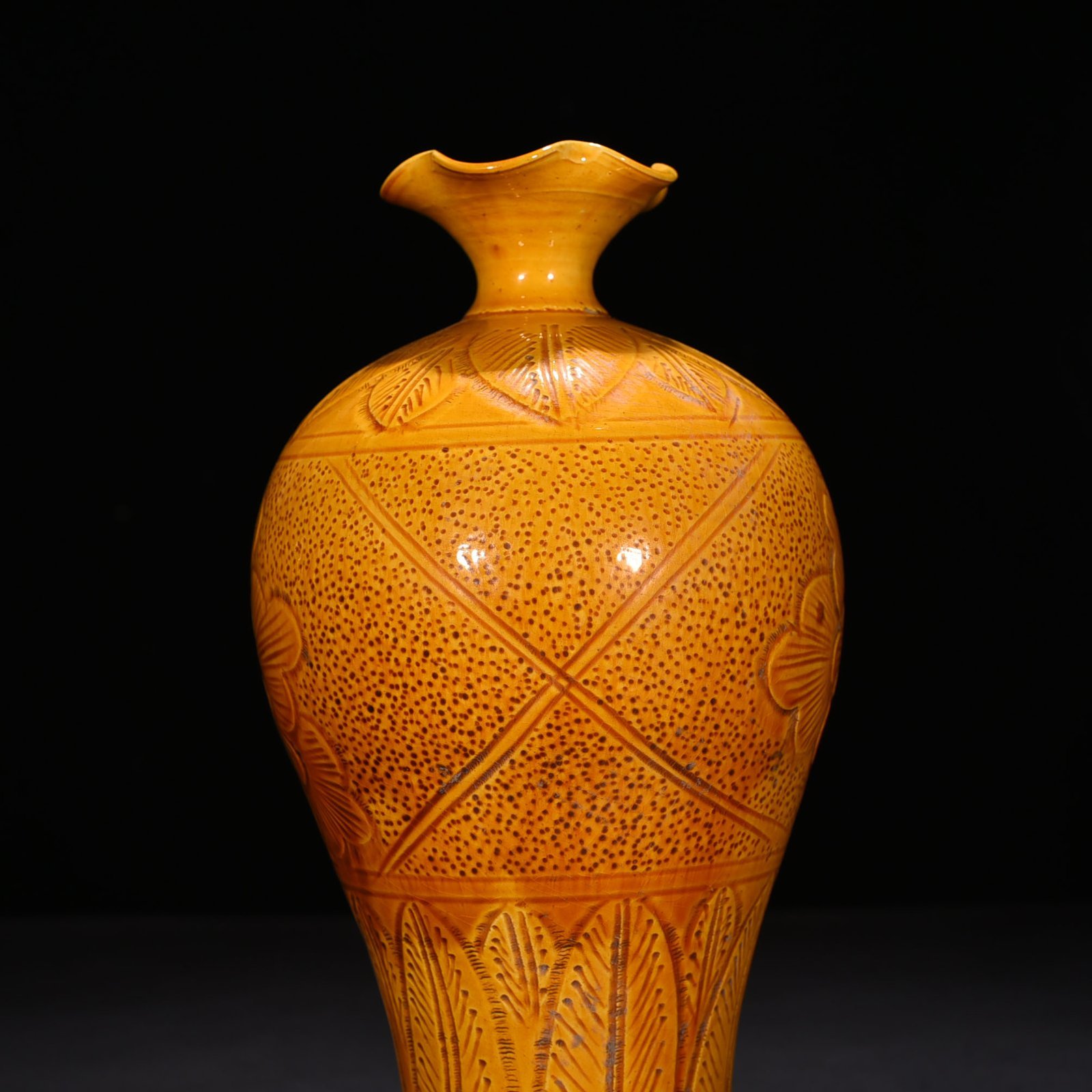 Song Dynasty Ding kiln yellow glaze engraved flower pattern plum vase