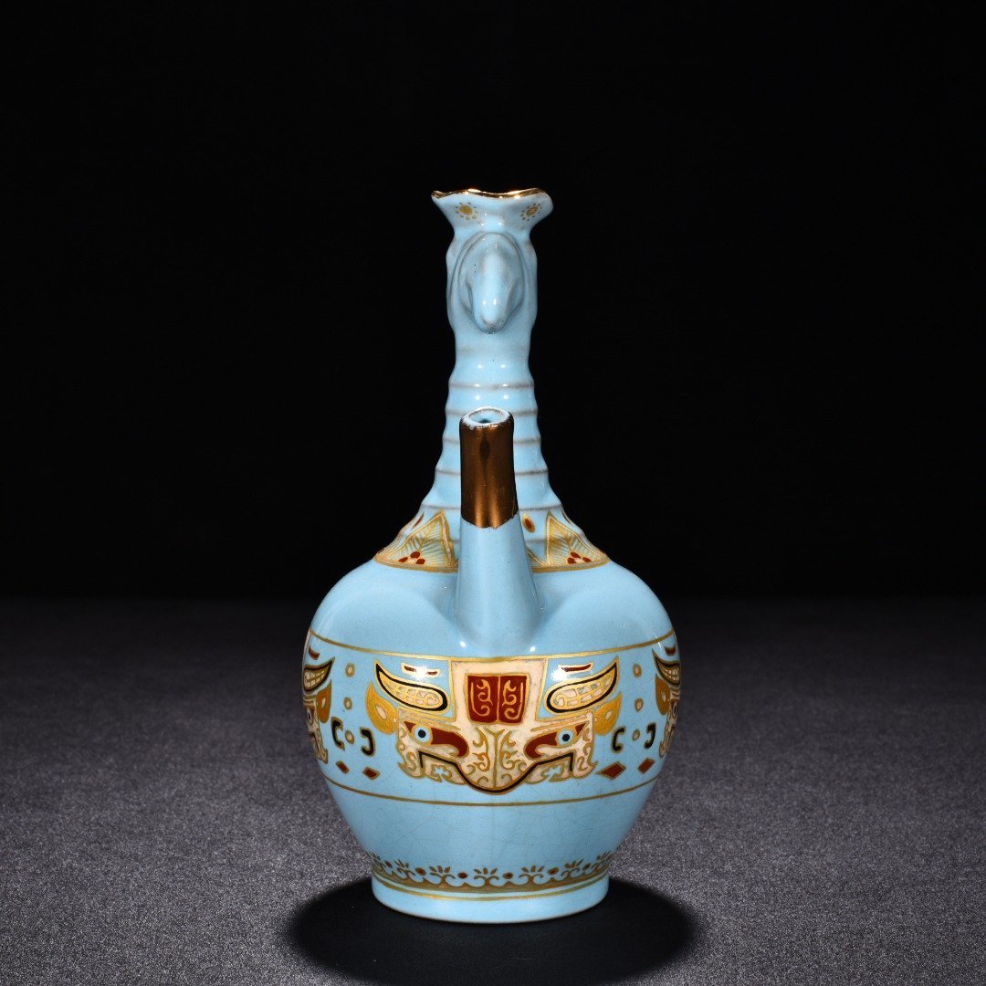 Song Dynasty Ru Kiln sky blue glaze gilded gluttonous animal face pattern eagle head pot