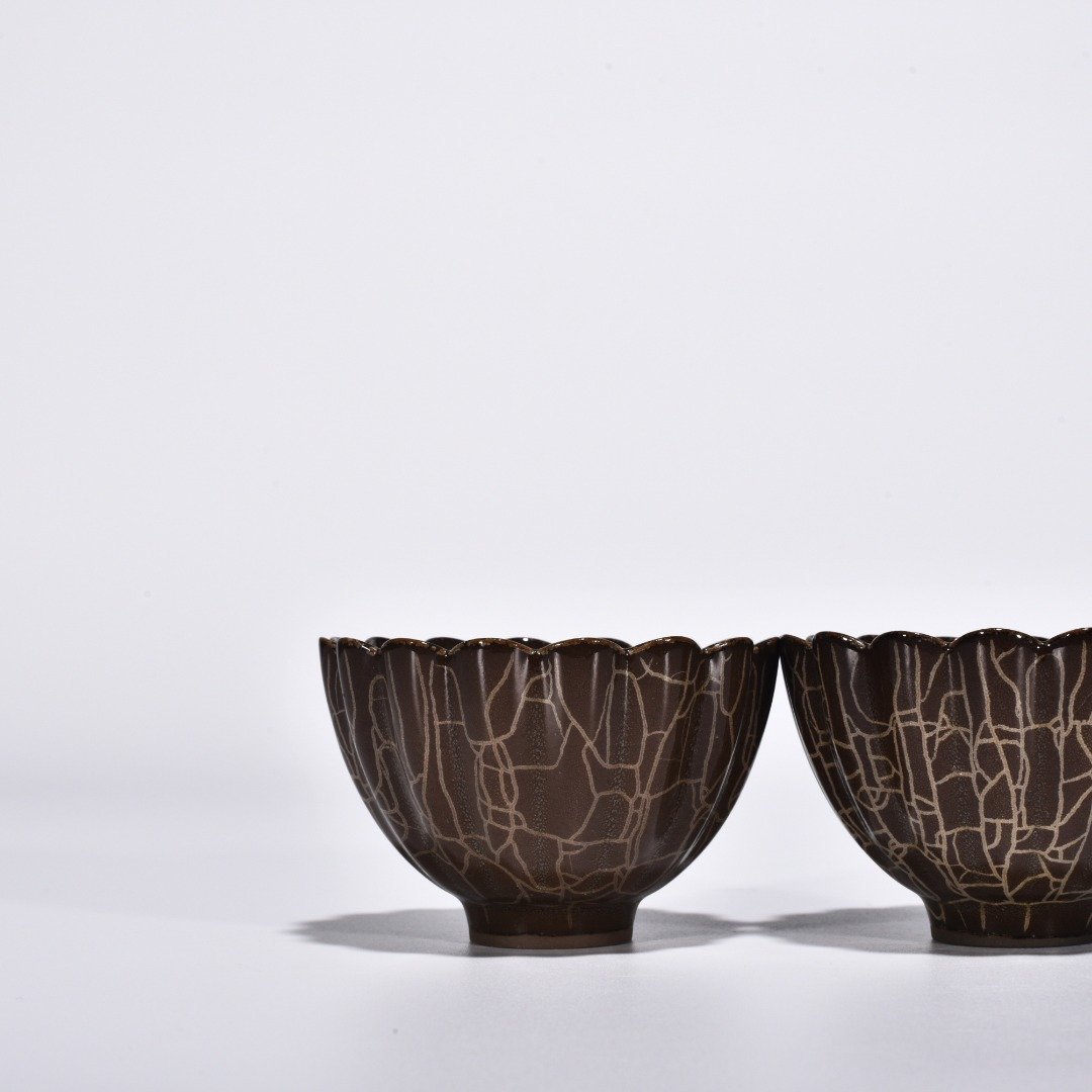Song Dynasty Xikou official kiln scraped chrysanthemum petal cup