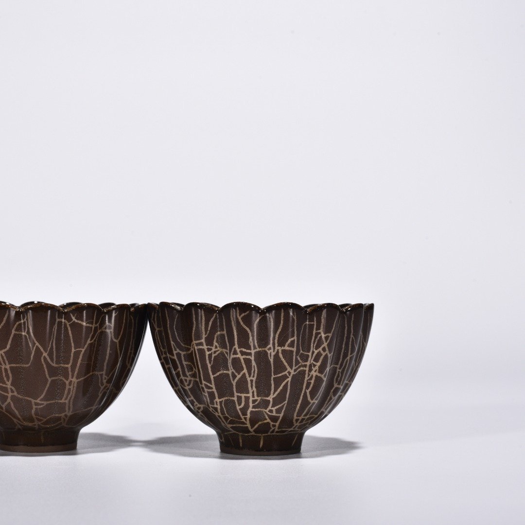 Song Dynasty Xikou official kiln scraped chrysanthemum petal cup