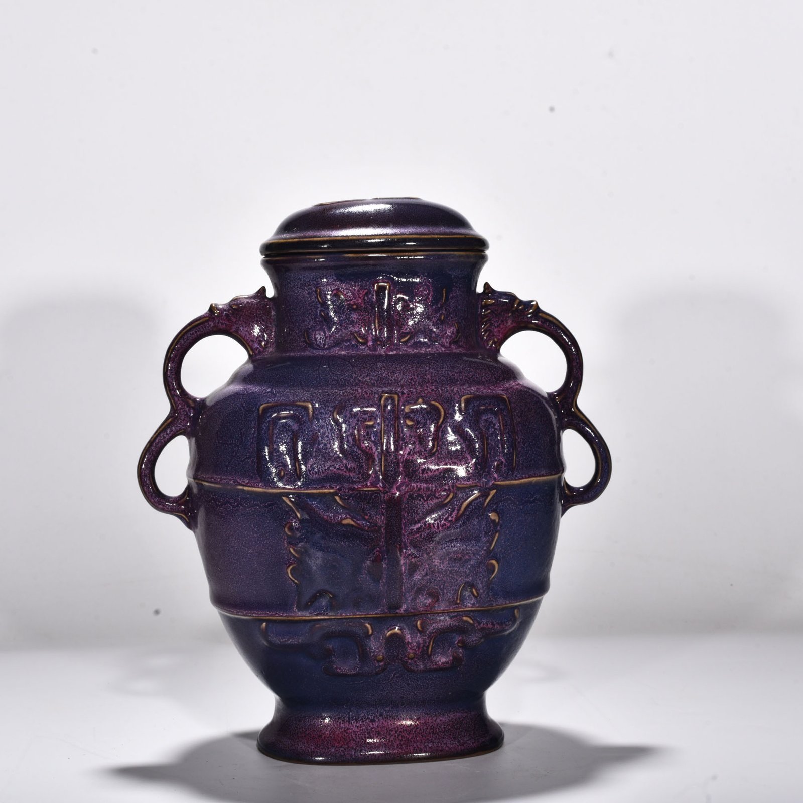Song Dynasty Jun kiln rose purple glaze animal mask pattern double-ear lid jar