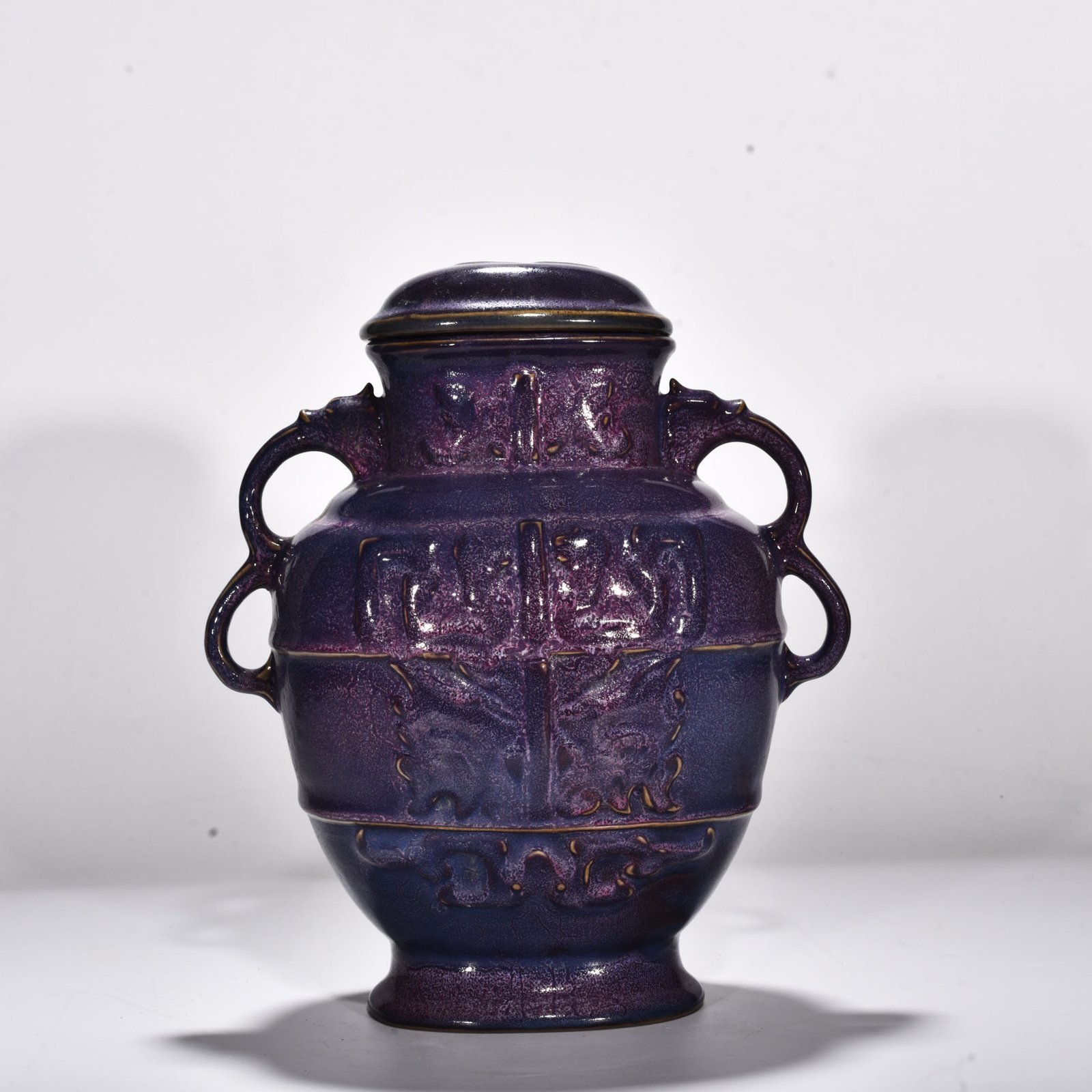 Song Dynasty Jun kiln rose purple glaze animal mask pattern double-ear lid jar