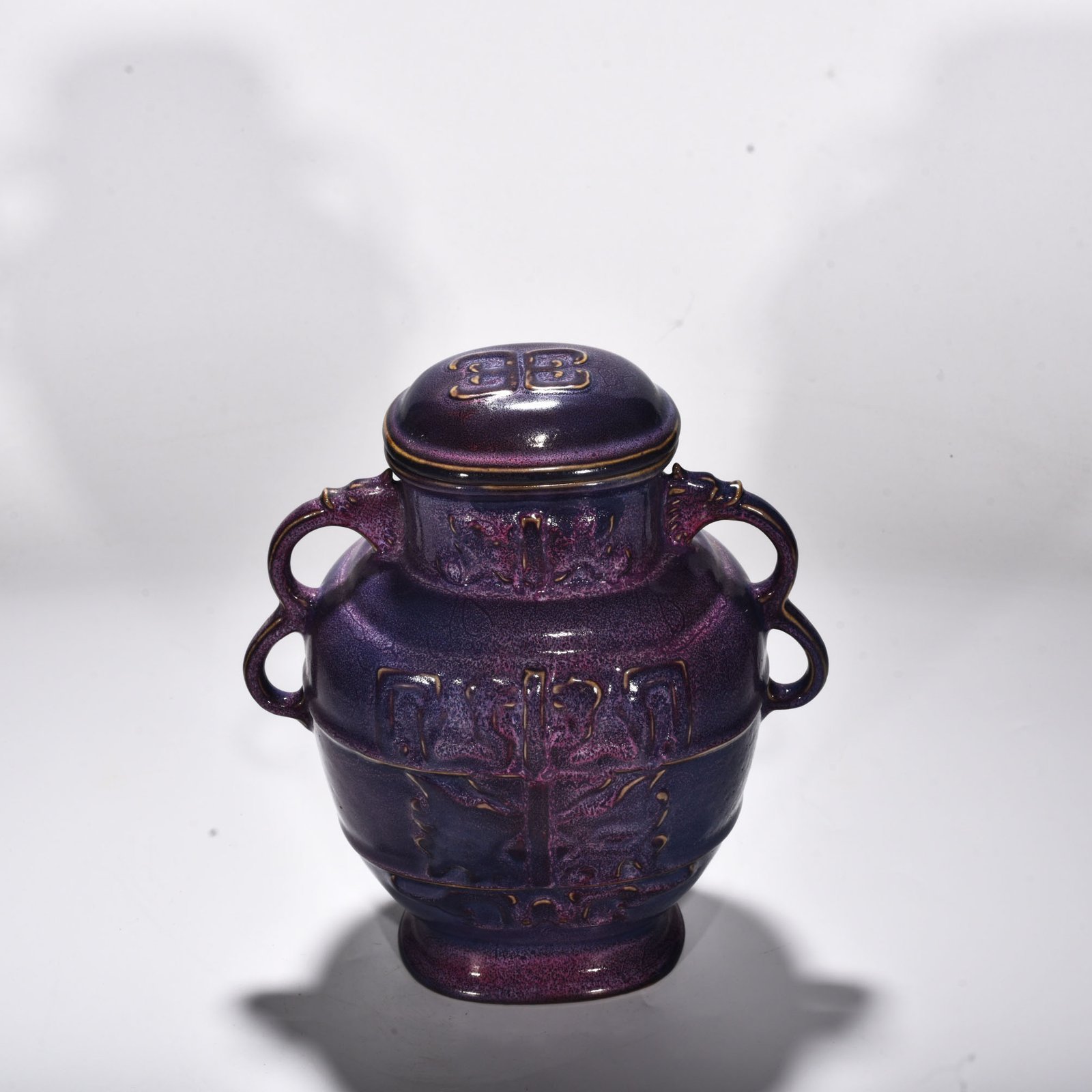 Song Dynasty Jun kiln rose purple glaze animal mask pattern double-ear lid jar