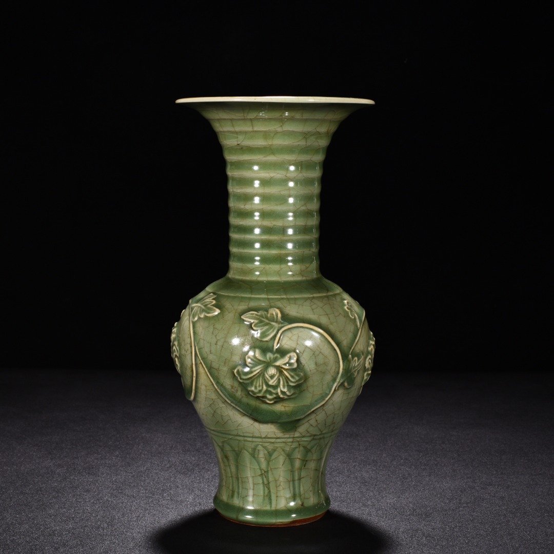 Song Dynasty Longquan kiln plum celadon glaze engraved flower vase