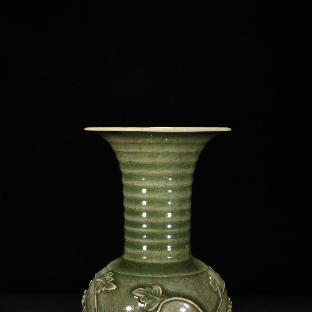 Song Dynasty Longquan kiln plum celadon glaze engraved flower vase