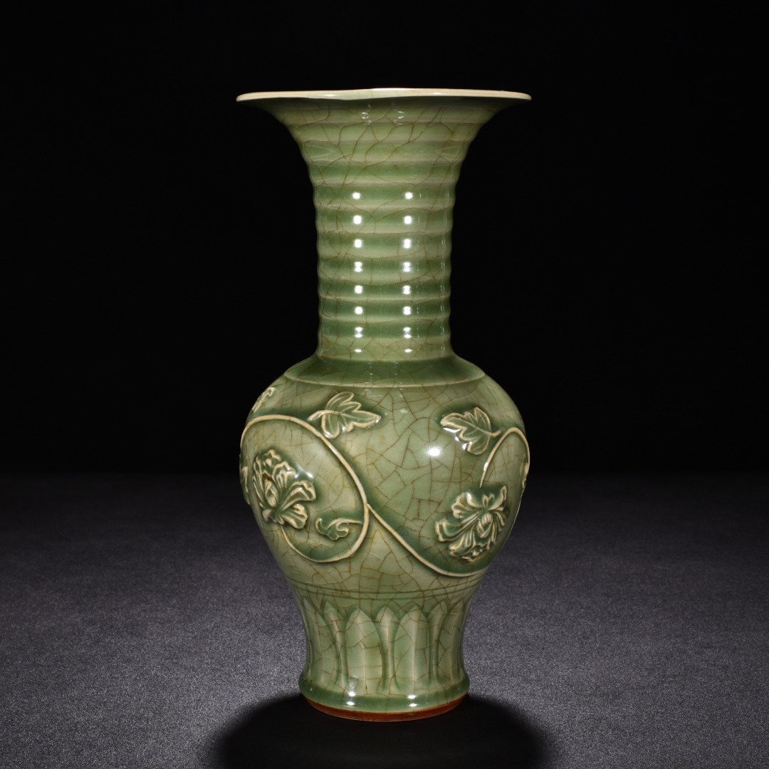 Song Dynasty Longquan kiln plum celadon glaze engraved flower vase