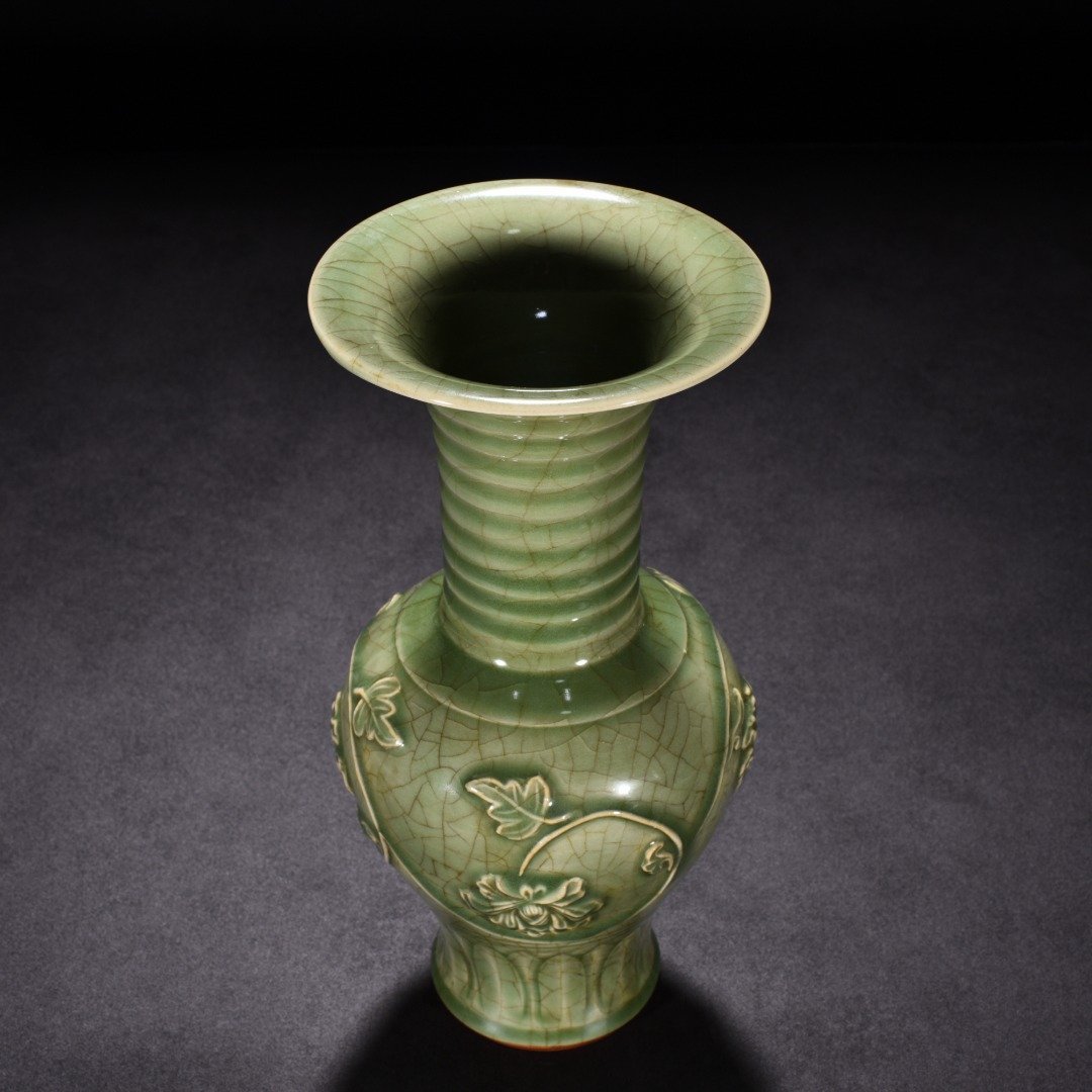 Song Dynasty Longquan kiln plum celadon glaze engraved flower vase