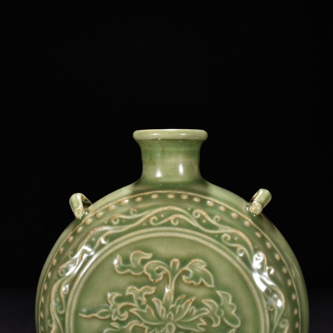 Song Dynasty Longquan kiln plum celadon glaze engraved flower pattern flat vase
