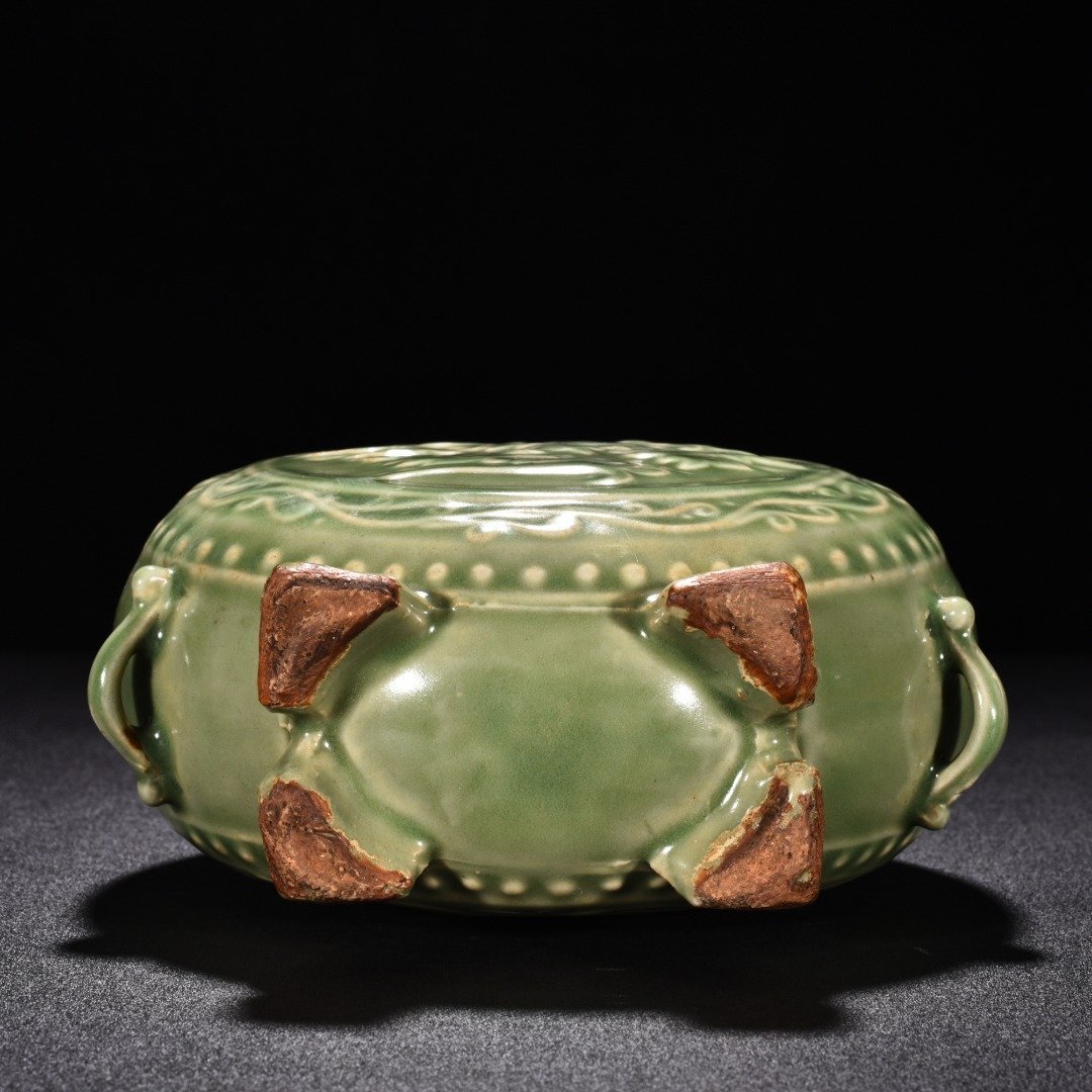 Song Dynasty Longquan kiln plum celadon glaze engraved flower pattern flat vase
