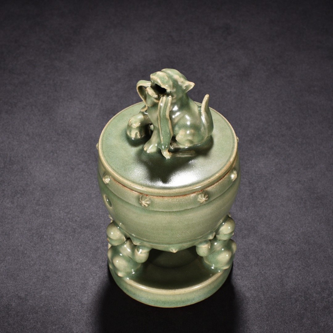 Song Dynasty Longquan kiln plum green glaze hollow lion smoker