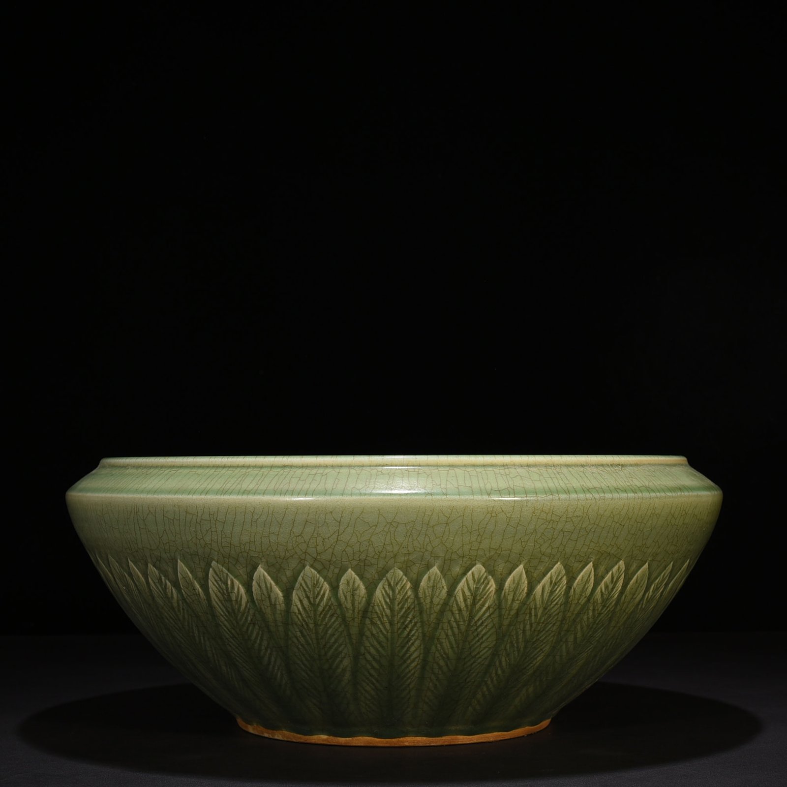 Song Dynasty Longquan kiln plum green glaze bowl with carved banana leaf pattern