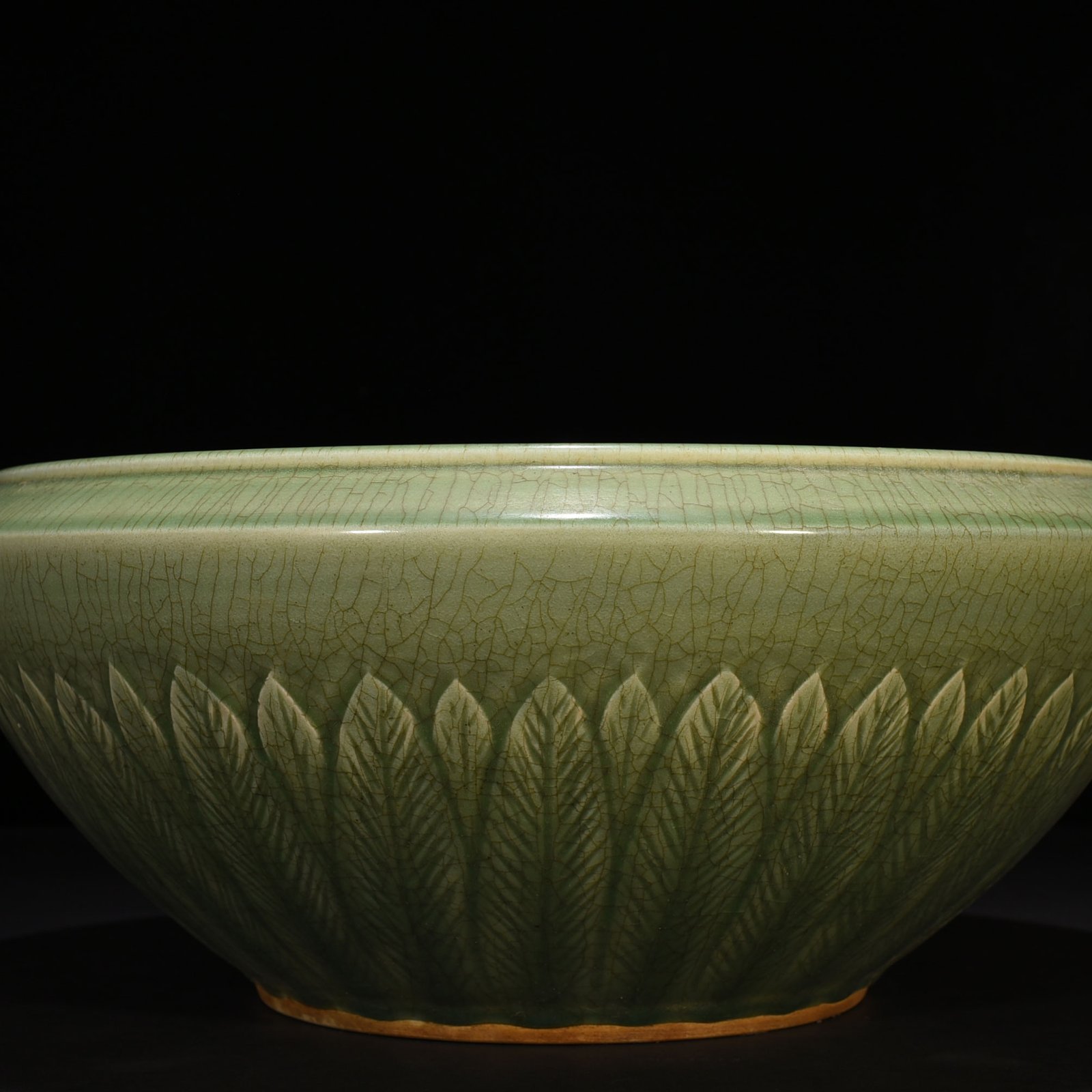 Song Dynasty Longquan kiln plum green glaze bowl with carved banana leaf pattern